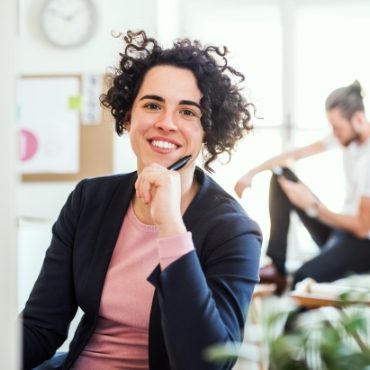 demo-attachment-89-a-portrait-of-young-businesswoman-sitting-in-a-JABCPXQ